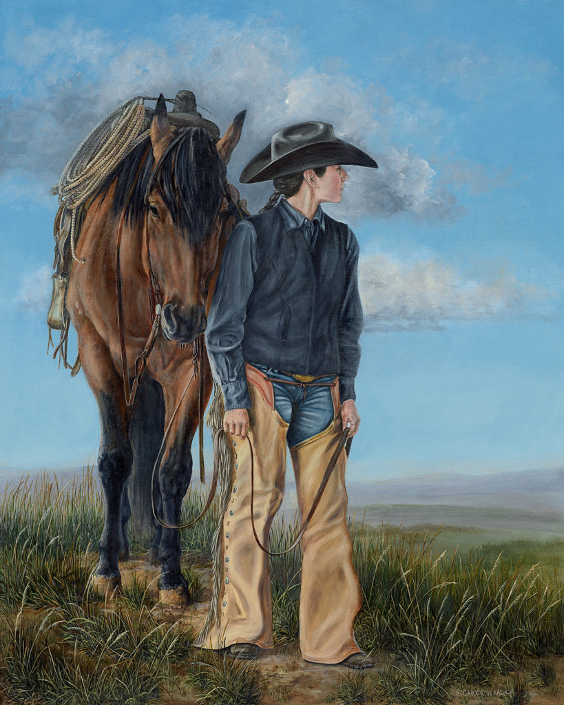 A cowboy with his horse looks to the horizon in an open field